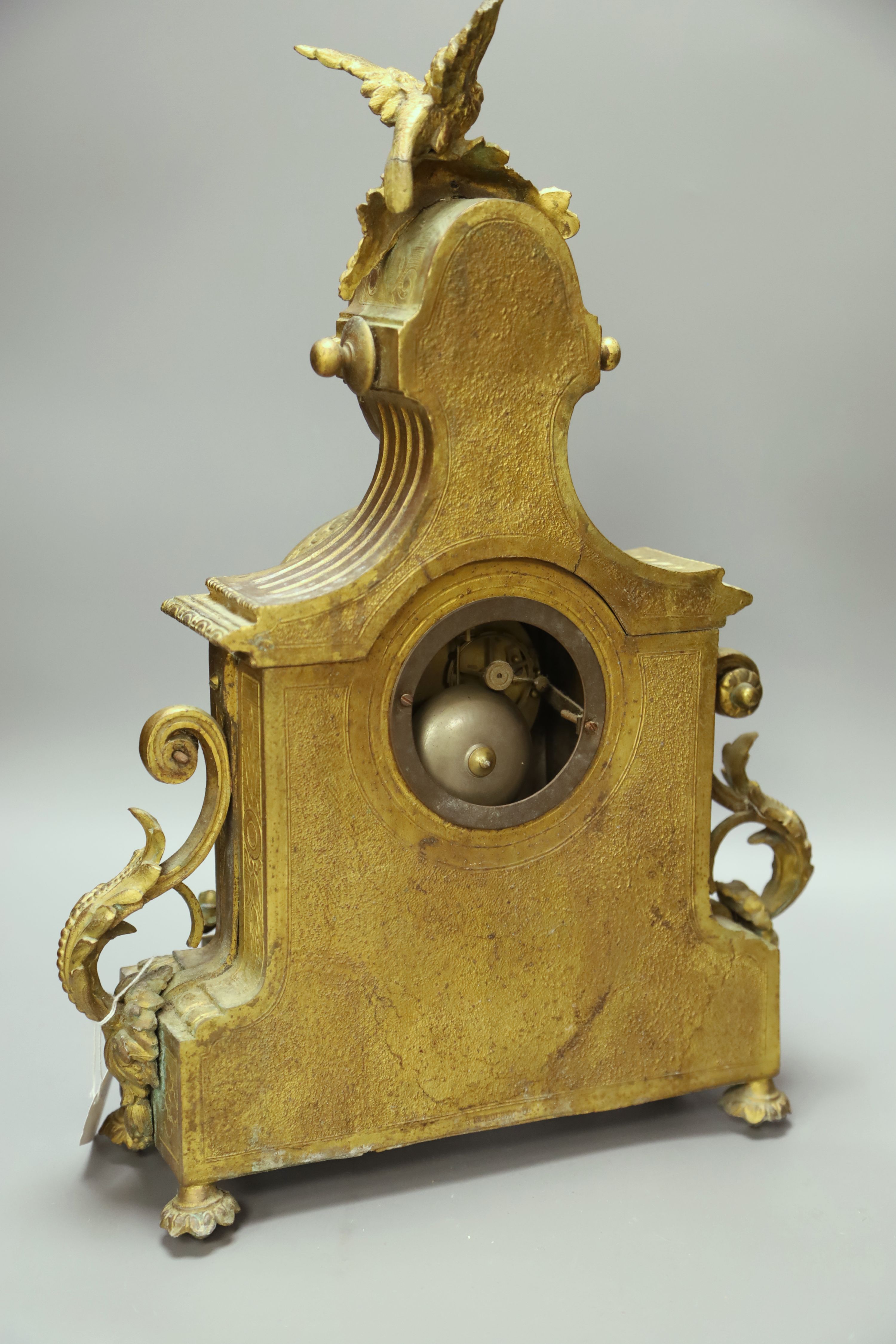 A French gilt metal mantel clock with Sevres-style panels, height 46cm